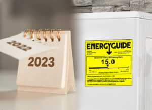 A desk calendar shows the year 2023 next to a white appliance with a yellow EnergyGuide label displaying a seasonal energy efficiency ratio of 15.0.